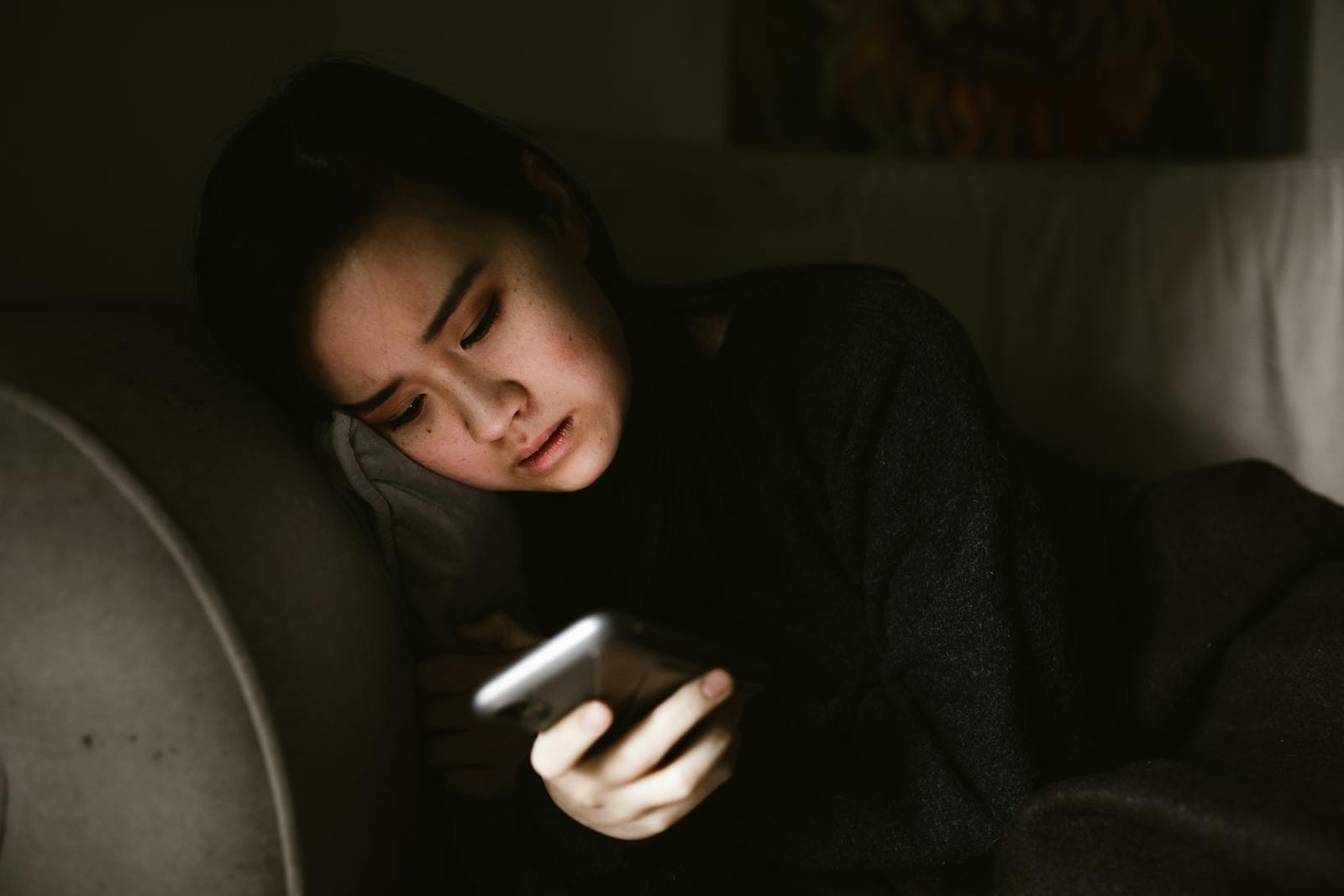 woman looking at phone