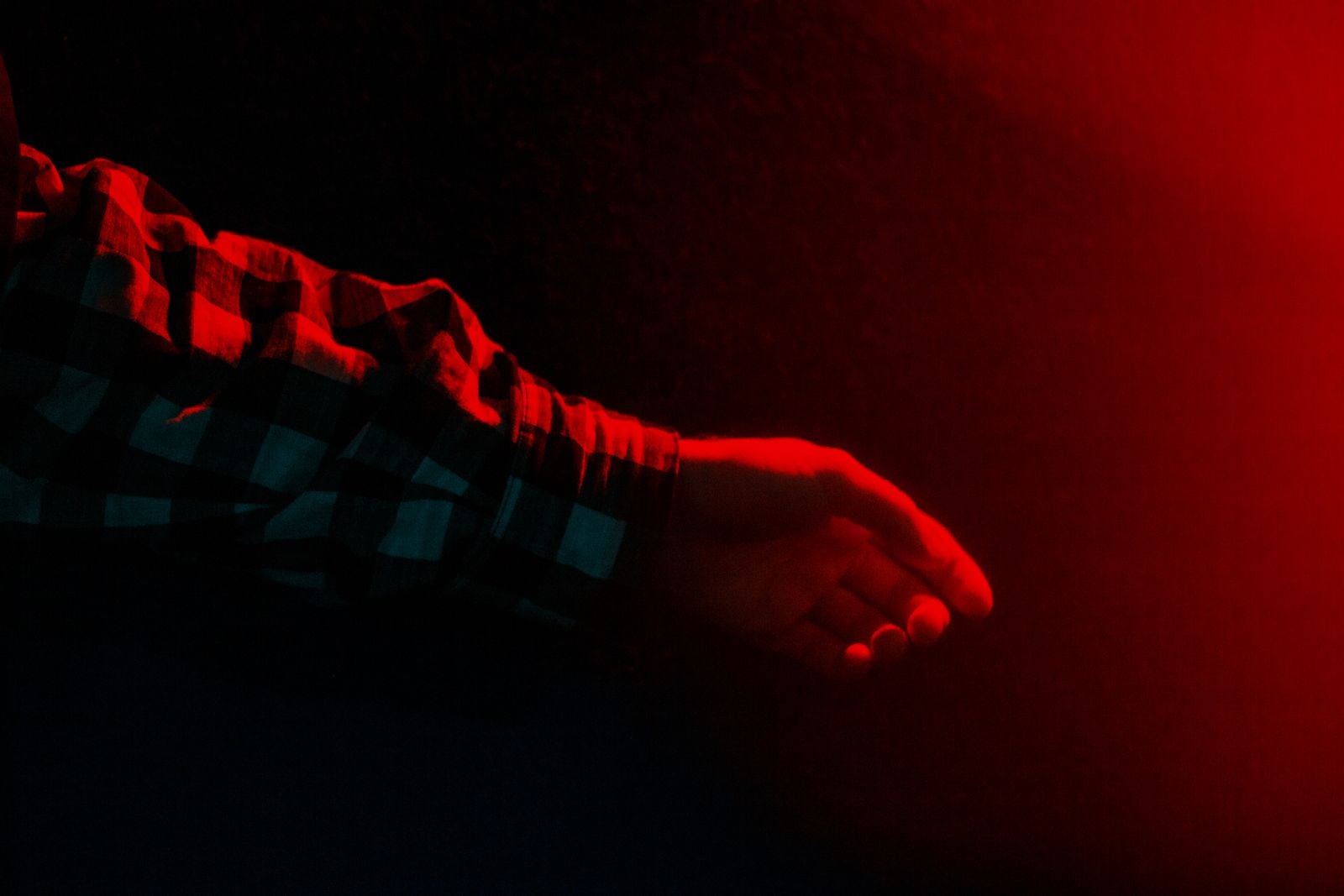hand reaching for unplugged lamp