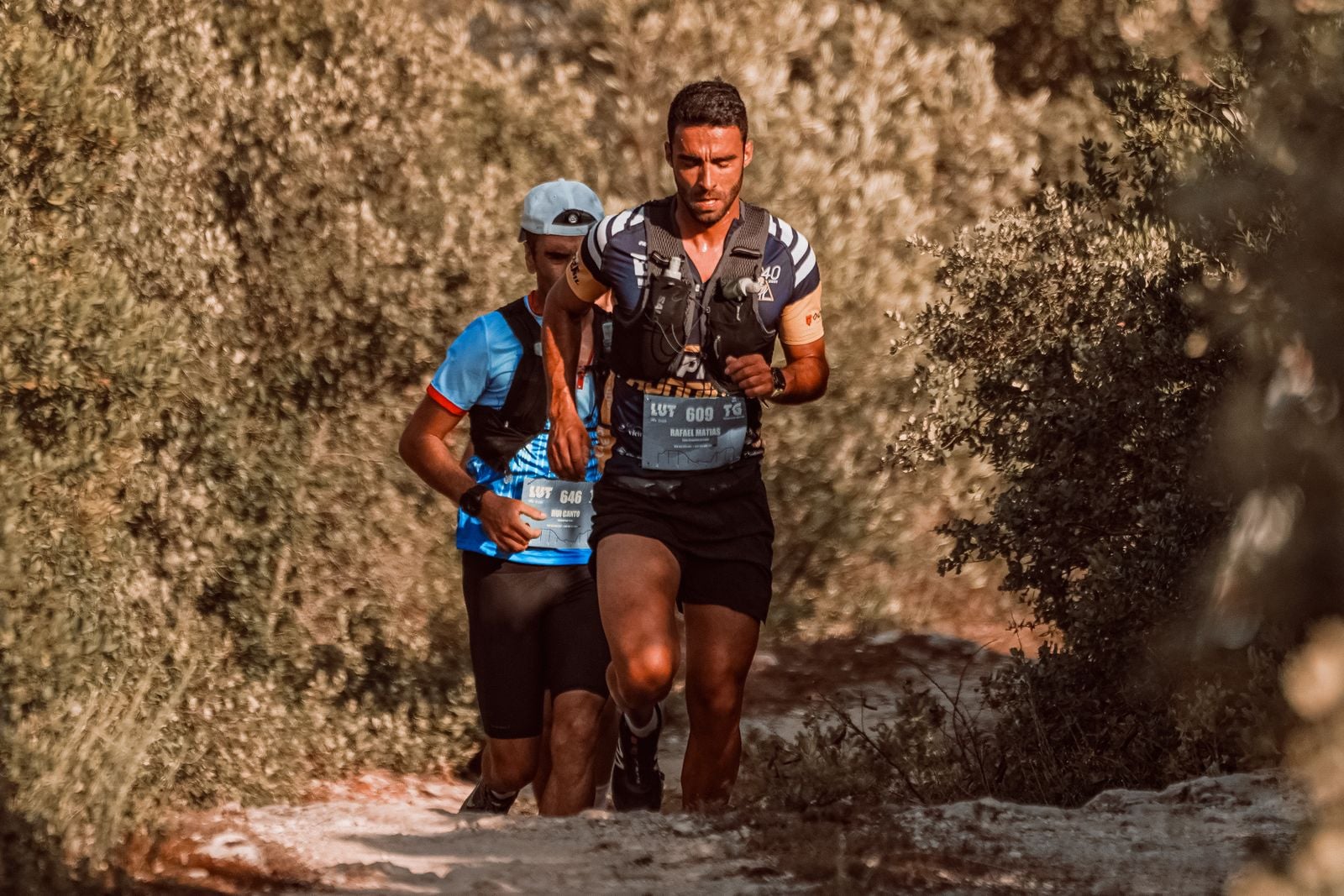 man running trail forest
