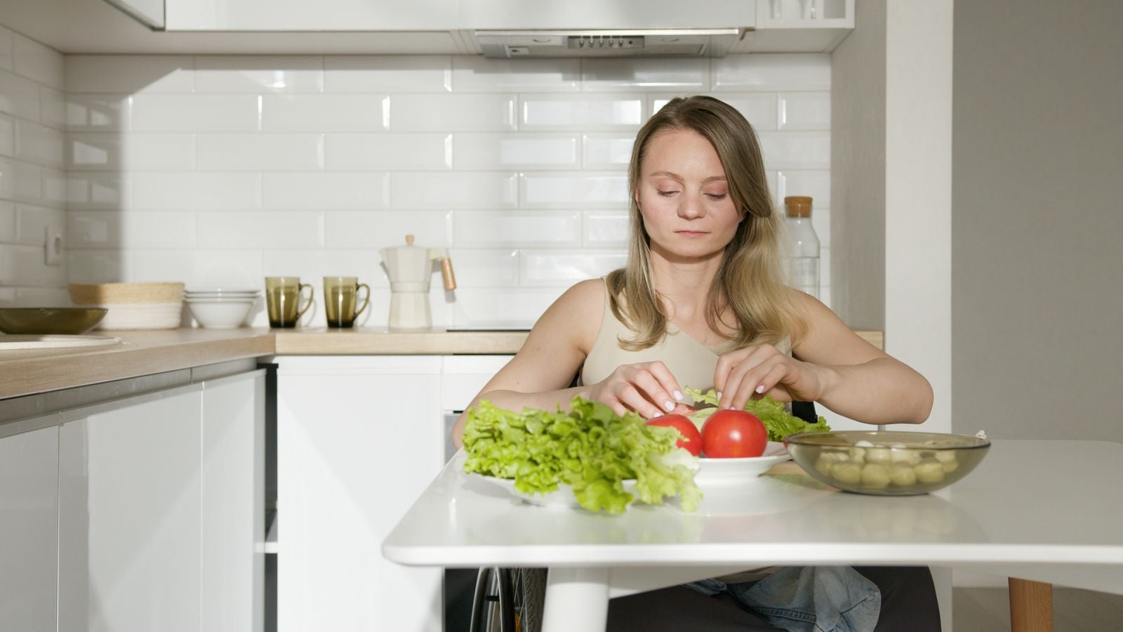 midlife woman cooking alone