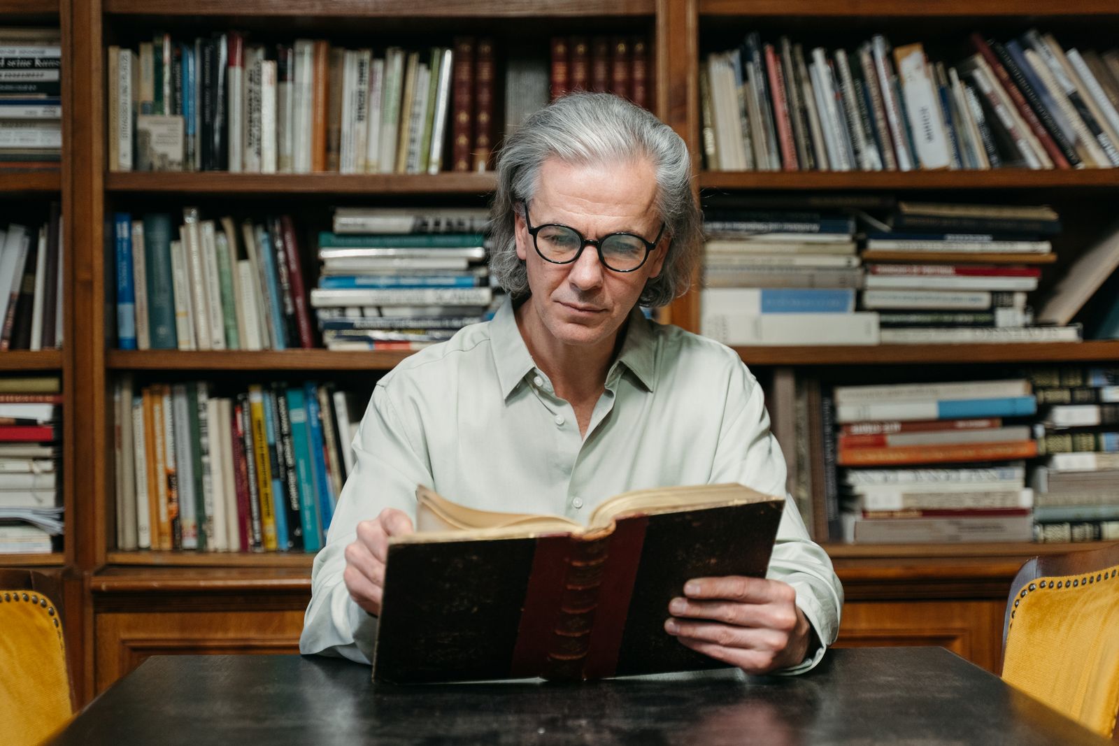 older man reading alone