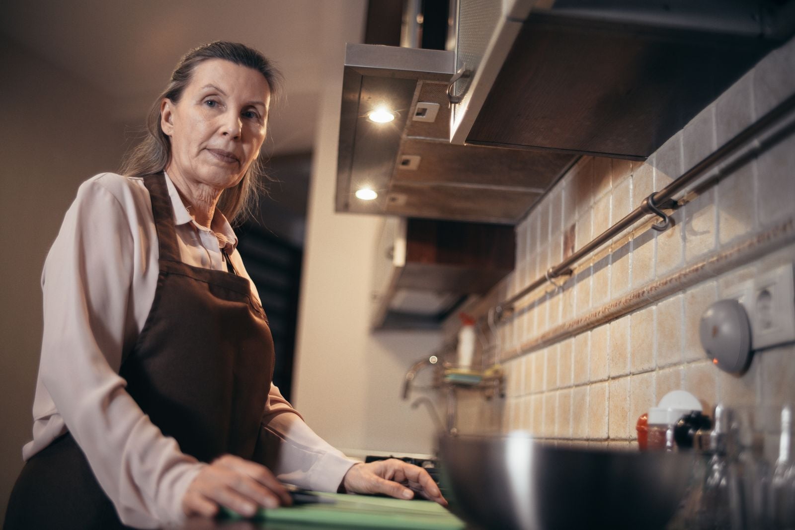 older woman cooking alone