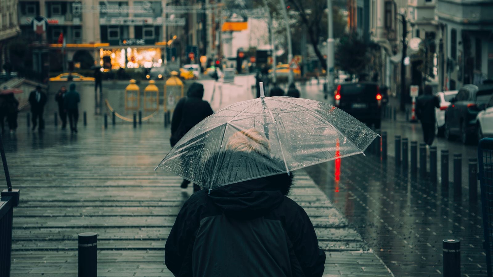 person walking in rain